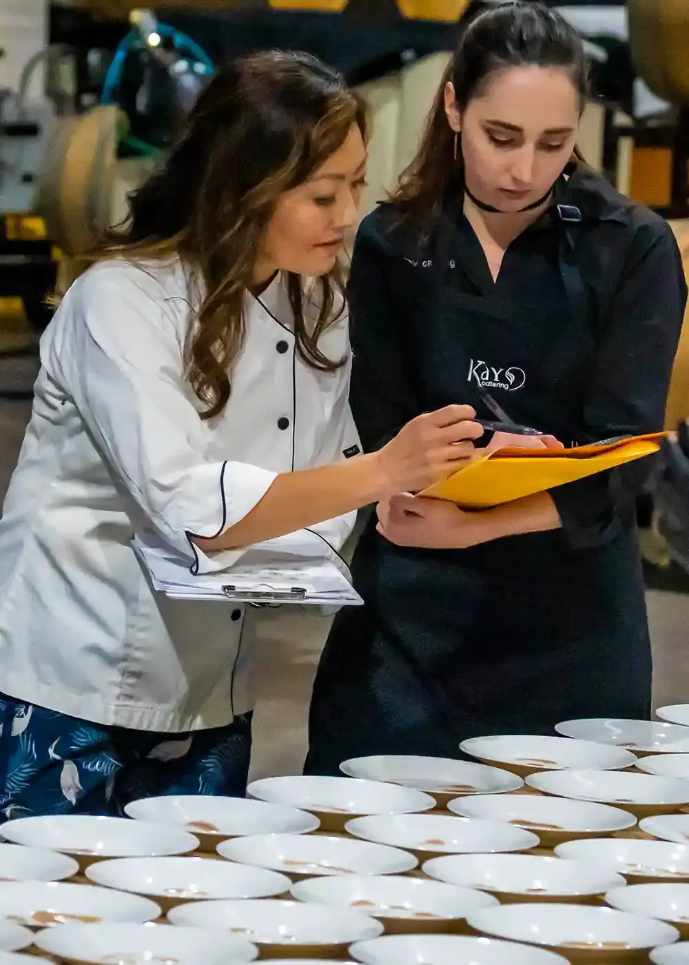 A happy couple eating at a K Catering event.